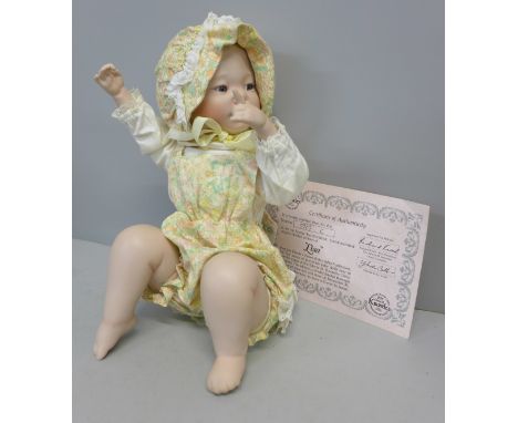 An Edwin M Knowles limited edition 'piano baby' doll, boxed with certificate 