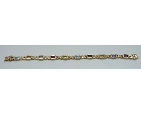A silver gilt bracelet set with amethyst, citrine, garnet and topaz, 19cm 