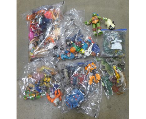 A box of mixed retro 1980s, 1990s, 2000s toys, Transformers, Ben10, He-Man, TMNT, action figures, toy soldiers, accessories, 