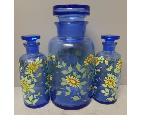 A blue glass and enamel lidded jar and a pair of two smaller **PLEASE NOTE THIS LOT IS NOT ELIGIBLE FOR POSTING AND PACKING**