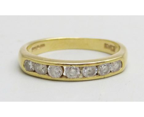 An 18ct gold channel set diamond ring, 0.5ct diamond weight, 2.8g, M 