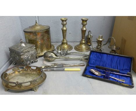 A collection of silver plated items including a Britannia tea caddy, condiment holder, tongs, and a box of flatware **PLEASE 