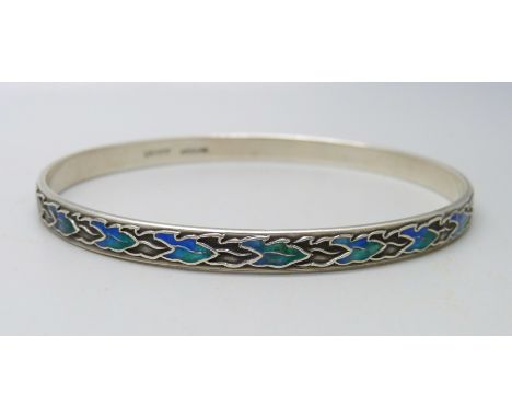 A Liberty Arts and Crafts enamel and silver bangle, marked 'Liberty' and 'Sterling', circa 1910, 23g, 7.4x6.9 cm opening 