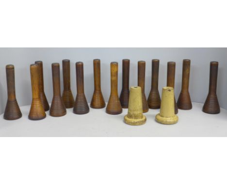 Sixteen 19th Century turned wooden cotton bobbin holders including two ceramic 