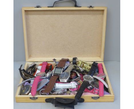 A box of modern fashion wristwatches including Casio 