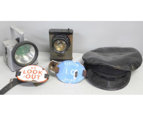 A British Rail peaked cap, two enamel arm badges, a lamp and a Metropolitan Police lamp 