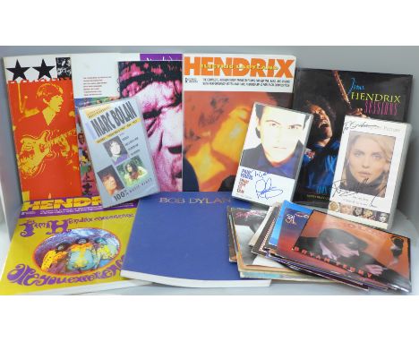 A collection of music tab song books, Jimi Hendrix x4, Bob Dylan and The Beatles, VHS videos signed by Debbie Harry and Paul 