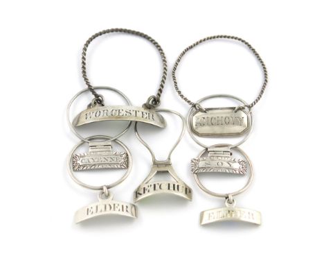 A small collection of seven George III silver neck-ring sauce labels, various dates and makers, one unmarked, comprising: a p