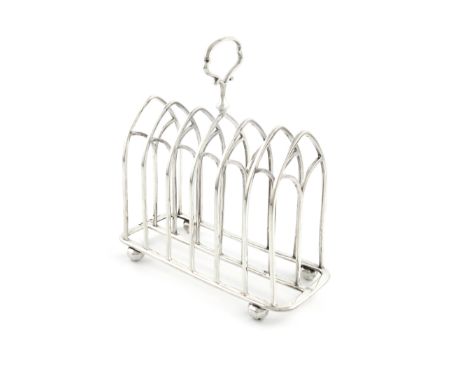 A Victorian silver seven-bar toast rack, by Roberts &amp; Slater, Sheffield 1858, Gothic arch form, central carrying handle, 