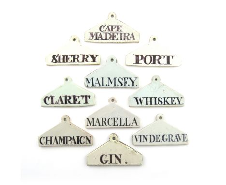 A collection of ten 18th and 19th century Delftware bin labels, coat hanger form, titled 'MALMSEY', 'CLARET', 'CHAMPAIGN', 'P