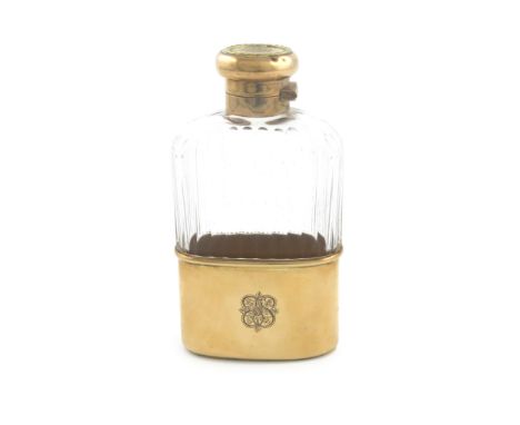 A 9-carat gold-mounted and glass spirit flask, by Asprey and Co., London 1916, rounded rectangular form, fluted glass body, p