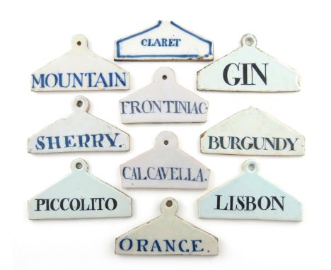 A collection of ten 18th and 19th century Delftware bin labels, coat hammer form, titled 'ORANGE', 'CLARET', 'GIN', 'PICCOLIT