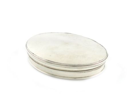 A George II silver snuff box, unmarked, circa 1740, oval form, the plain hinged covers to reveal a secondary cover engraved w