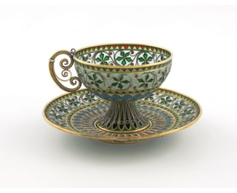 A Norwegian silver-gilt and plique à jour cup and saucer, by Marius Hammer, Bergen circa 1910, circular form, with vari-colou