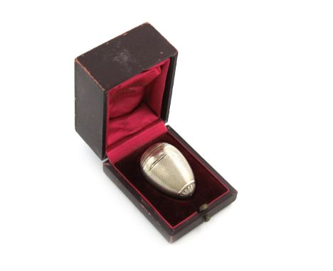 A late 19th century French silver vinaigrette, retailed by Odiot, Paris, egg form, engine-turned decoration, foliate terminal