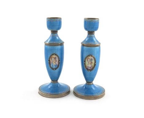 A pair of Austrian silver and enamel candlesticks, by R.S, tapering circular form, plain urn capitals with blue enamel decora