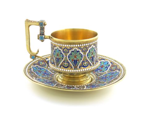 A late 19th century Russian silver-gilt and enamel cup and saucer, maker's mark M.T, possibly for M. Takkinen, circa 1890, ci