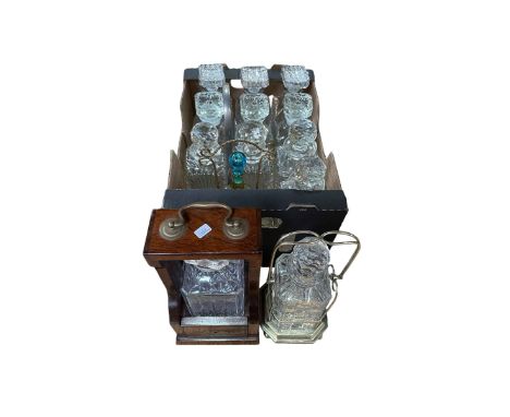 Collection of decanters, two with tantalus stands.