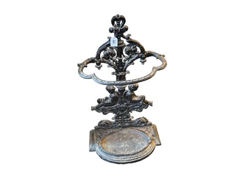 Cast iron cherub decorated stick stand, 82cm by 46cm by 26cm.