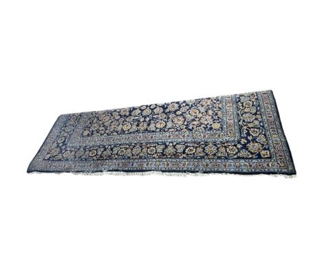 Persian carpet with central medallion on blue ground, 3.90 by 2.93.