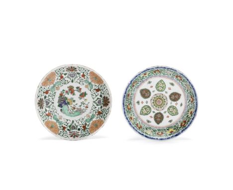 Two large famille verte dishesKangxiThe first decorated with floral and foliate panels to the centre, within a band of leafy 