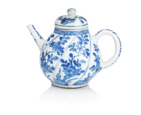 A blue and white teapot and coverKangxi periodOf wrythen lobed form and decorated to the six panels with flowering plants iss