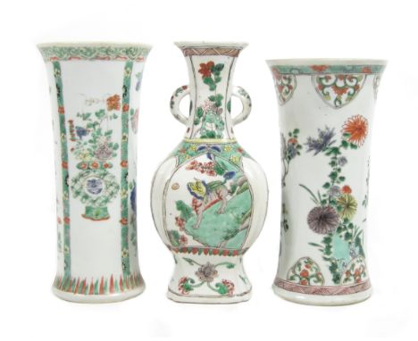 Three famille verte vases18th centuryThe first of square lobed baluster form with flaring neck and twin handles, enamelled wi