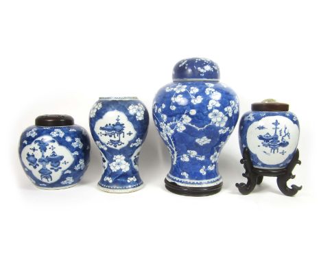 A collection of blue and white 'prunus' jars and coversKangxiThe largest a baluster example with domed cover (damages), 37cm 