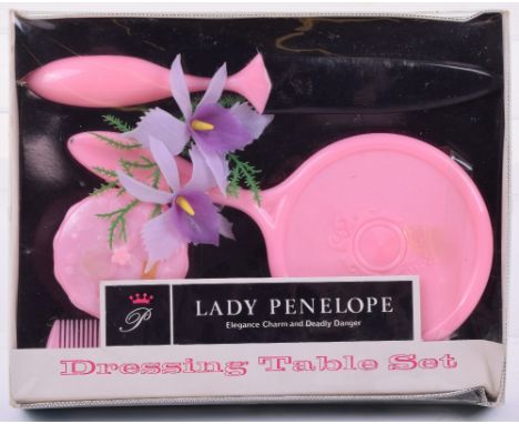 A JR 21 Toy Lady Penelope Dressing Table Set, from Gerry Andersons Thunderbirds, circa 1965, pink  comb, brush, mirror, powde