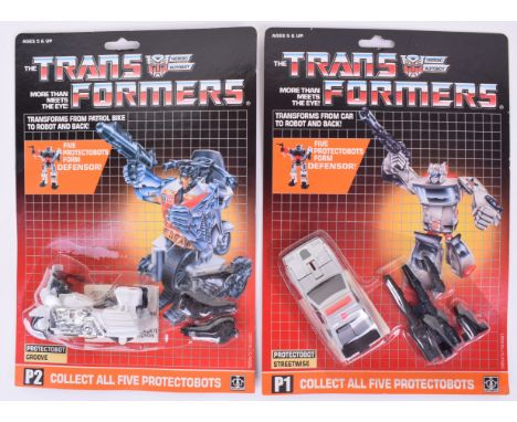 Two Original Carded Hasbro G1 Transformers, P1 Protectobot  ‘Sreetwise’  transforms from car to robot and back and P2 Protect