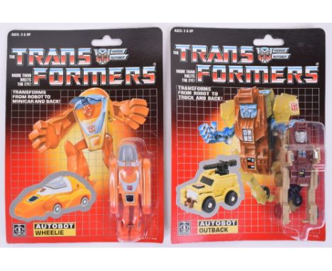 Two Original Carded Hasbro G1 Transformers, Autobot Outback and Autobot Wheelie, 1985 issues transforms from robot to truck/m