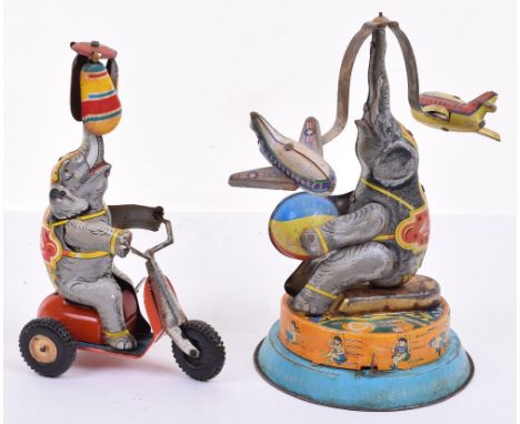 Two tinplate clockwork performing Elephants, German 1950s, lithographed wind-up tricycle riding elephant with spinning sails 