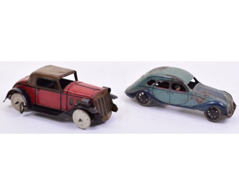 Marx (USA) tinplate clockwork car with electric lights, red car with black lining and brown hood, electric front lights and s