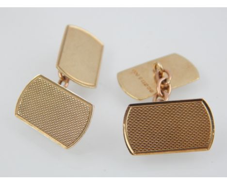 Pair of engine turned 9ct yellow gold chain cufflinks.