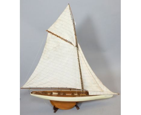 Victorian style scale model pond yacht, with linen sail, cream and red painted band to hull, 119cm h.