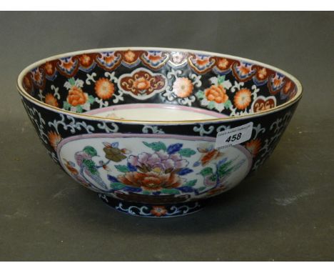 A Chinese famille noir porcelain bowl with bird and flower enamel decoration, mid C20th, 12'' diameter, 6'' high