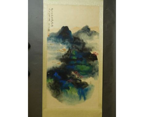 A Chinese scroll with watercolour of a figure in a landscape of cherry blossom trees, with inscription and seal mark, 49'' x 