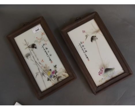 A pair of Chinese porcelain plaques with enamel decoration depicting small birds on bamboo, with verse and seal mark, in hard