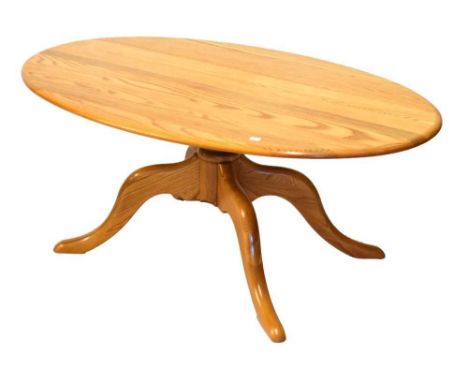 Ercol Golden Dawn elm coffee table on quatrefoil base, 52cm x 121cm.Condition report: Light scratches present, with some sign