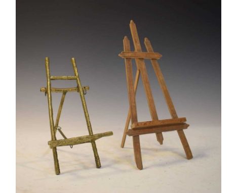 Gilt metal miniature easel, together with a similar wooden easel, 22cm high and smaller.