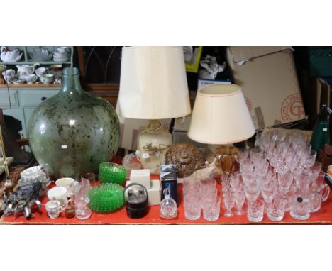 Two pottery table lamp bases with shade; a pottery snail ornament; various drinking vessels; a green glass carboy, etc. 