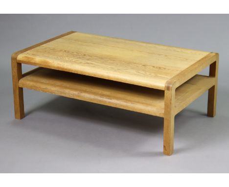 A light oak rectangular two-tier low coffee table on four short square legs, 103.5cm wide x 40.5cm high x 64.5cm deep. 