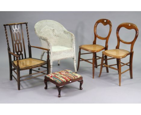 A pair of beech occasional chairs with open kidney-shaped backs, woven-cane seats, &amp; on turned legs with spindle stretche