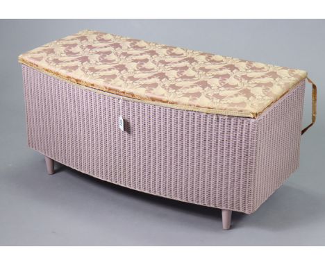 A Lusty’s Lloyd Loom pink painted bow-front blanket box with a hinged lift-lid, 90.5cm wide. 