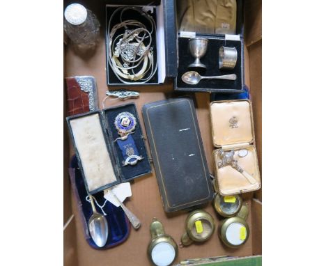 A collection of items, to include brass pocket watch cases, a hallmarked silver christening spoon and fork, costume jewellery