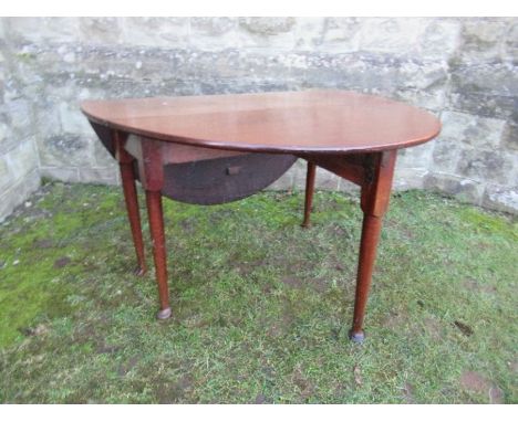 A Georgian mahogany gate leg table, raised on turned legs terminating in pad feet, width 48ins x height 28.5ins x max length 