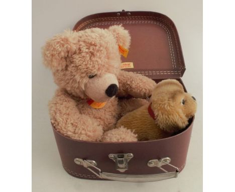 A Steiff plush dog, Cockie, together with a Steiff bear and a Steiff suitcase