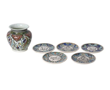 FIVE POLYCHROME-PAINTED TURKISH KUTAHYA-STYLE POTTERY SAUCERS AND A VASETurkey, ca. 1970s - 2000s
Comprising five circular sm