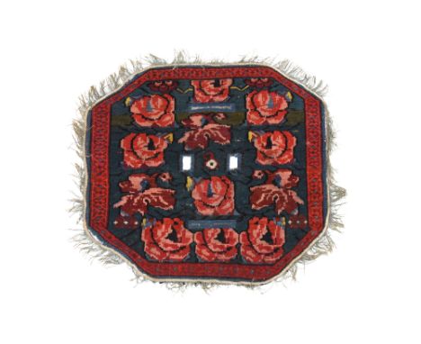 A RARE OCTAGONAL SADDLE POMMEL CARPET COVERPossibly Kirman, Central Iran, late 19th century
The knotted pile woven in coloure