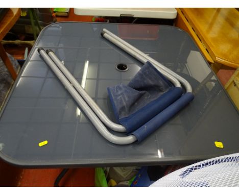 Washing basket full of hand tools and a bag of sandpaper and sanding equipment